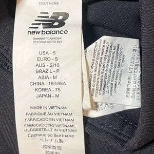 New balance leggings with thick black & white stripe on sides